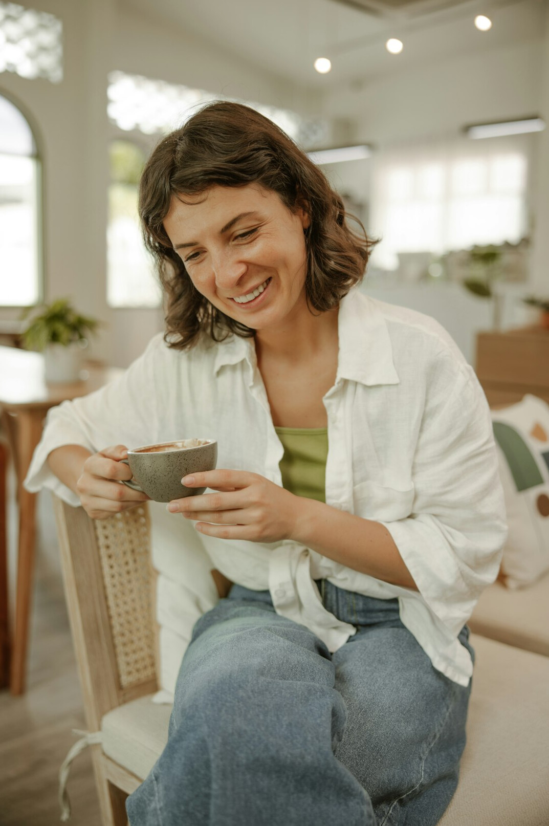 Woman smiling while talking with a health insurance advisor