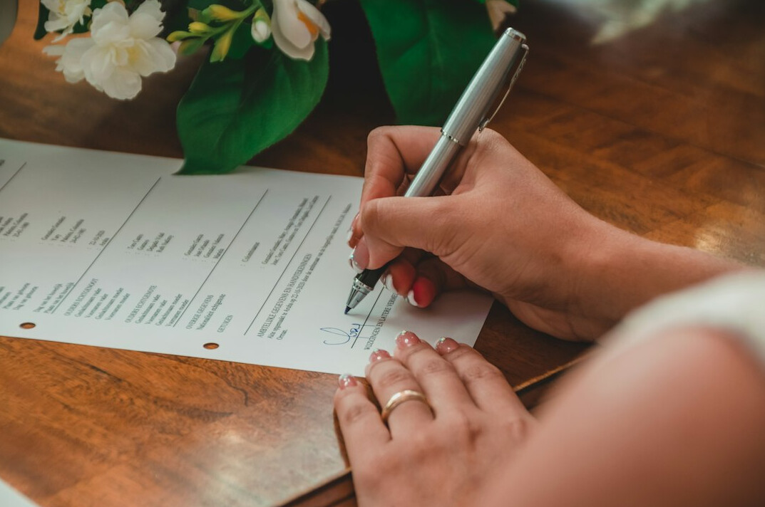 person signing insurance papers